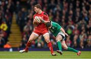 14 March 2015; George North, Wales, is tackled by Jonathan Sexton, Ireland. RBS Six Nations Rugby Championship, Wales v Ireland. Millennium Stadium, Cardiff, Wales. Picture credit: Stephen McCarthy / SPORTSFILE