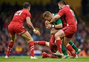 14 March 2015; Ian Madigan, Ireland, is tackled by Luke Charteris and Rob Evans, right, Wales. RBS Six Nations Rugby Championship, Wales v Ireland, Millennium Stadium, Cardiff, Wales. Picture credit: Brendan Moran / SPORTSFILE
