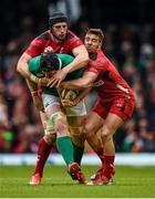 14 March 2015; Sean O'Brien, Ireland, is tackled by Luke Charteris, left, and Rhys Webb, Wales. RBS Six Nations Rugby Championship, Wales v Ireland. Millennium Stadium, Cardiff, Wales. Picture credit: Stephen McCarthy / SPORTSFILE