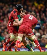 14 March 2015; Cian Healy, Ireland, attempts to break through the tackles of Luke Charteris, left, and Alun Myn Jones, Wales. RBS Six Nations Rugby Championship, Wales v Ireland, Millennium Stadium, Cardiff, Wales. Picture credit: Brendan Moran / SPORTSFILE
