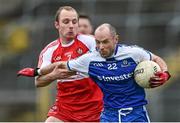 15 March 2015; xStephen Gollogly, Monaghan, is tackled by Sean Leo McGoldrick, Derry. Allianz Football League, Division 1, Round 5, Monaghan v Derry, St Tiernach’s Park, Clones, Co. Monaghan. Picture credit: Ramsey Cardy / SPORTSFILE