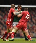 14 March 2015; Jared Payne, Ireland, is tackled by Dan Biggar, left, and Jamie Roberts, Wales. RBS Six Nations Rugby Championship, Wales v Ireland, Millennium Stadium, Cardiff, Wales. Picture credit: Brendan Moran / SPORTSFILE
