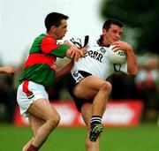 11 June 2000; Paul Taylor of Sligo is tackled by Rory Hannick of  Mayo during the Bank of Ireland Connacht Senior Football Championship Quarter-Final match between Sligo and Mayo at Markievicz Park in Sligo. Photo by Damien Eagers/Sportsfile