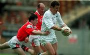 11 June 2000; John Finn of Kildare in action against Simon Gerard of Louth during the Bank of Ireland Leinster Senior Football Championship Quarter-Final match between Kildare and Louth at Croke Park in Dublin. Photo by Brendan Moran/Sportsfile