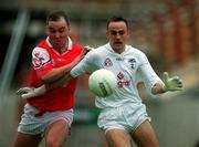 11 June 2000; Brian Lacey of Kildare in action against Cathal O'Hanlon of Louth during the Bank of Ireland Leinster Senior Football Championship Quarter-Final match between Kildare and Louth at Croke Park in Dublin. Photo by Brendan Moran/Sportsfile