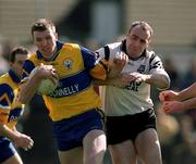 9 April 2000; Brian Considine of Clare in action against Paul Durcan of Sligo during the Church & General National Football League Division 1B match between Clare and Sligo at Cusack Park in Ennis, Clare. Photo by Damien Eagers/Sportsfile