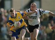 9 April 2000; Brian Considine of Clare in action against Paul Durcan of Sligo during the Church & General National Football League Division 1B match between Clare and Sligo at Cusack Park in Ennis, Clare. Photo by Damien Eagers/Sportsfile