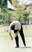 1 August 1999; Darren Clarke collects his ball from the hole after he shot a hole-in-one at the 5th during day three of the Smurfit European Open at The K Club in Straffan, Kildare. Photo by Matt Browne/Sportsfile