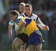9 April 2000; Ger Keane of Clare in action against Brendan Philips of Sligo during the Church & General National Football League Division 1B match between Clare and Sligo at Cusack Park in Ennis, Clare. Photo by Damien Eagers/Sportsfile