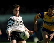 9 April 2000; Gerry McGowan of Sligo in action against Padraig Gallagher of Clare during the Church & General National Football League Division 1B match between Clare and Sligo at Cusack Park in Ennis, Clare. Photo by Damien Eagers/Sportsfile