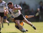 9 April 2000; Paul Taylor of Sligo in action against Neil Hawes of Clare during the Church & General National Football League Division 1B match between Clare and Sligo at Cusack Park in Ennis, Clare. Photo by Damien Eagers/Sportsfile