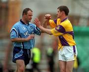 11 June 2000; Vinny Murphy of Dublin tussles with Sean O'Shaughnessy of Wexford during the Bank of Ireland Leinster Senior Football Championship Quarter-Final match between Dublin and Wexford at Croke Park in Dublin. Photo by Brendan Moran/Sportsfile