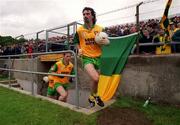 11 June 2000; Donegal captain Jim McGuinness leads his team onto the pitch prior to the Bank of Ireland Ulster Senior Football Championship Quarter-Final match between Donegal and Fermanagh at MacCumhail Park in Ballybofey, Donegal. Photo by Ray Lohan/Sportsfile