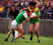 11 June 2000; Jim McGuinness of Donegal in action against Paul Brewster of Fermanagh during the Bank of Ireland Ulster Senior Football Championship Quarter-Final match between Donegal and Fermanagh at MacCumhail Park in Ballybofey, Donegal. Photo by Ray Lohan/Sportsfile