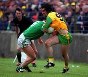 11 June 2000; Jim McGuinness of Donegal in action against Paul Brewster of Fermanagh during the Bank of Ireland Ulster Senior Football Championship Quarter-Final match between Donegal and Fermanagh at MacCumhail Park in Ballybofey, Donegal. Photo by Ray Lohan/Sportsfile