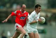 11 June 2000; John Finn of Kildare in action against Stephen Melia of Louth during the Bank of Ireland Leinster Senior Football Championship Quarter-Final match between Kildare and Louth at Croke Park in Dublin. Photo by Brendan Moran/Sportsfile