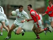 11 June 2000; John Finn of Kildare in action against JP Rooney of Louth during the Bank of Ireland Leinster Senior Football Championship Quarter-Final match between Kildare and Louth at Croke Park in Dublin. Photo by Brendan Moran/Sportsfile