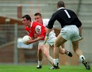 11 June 2000; Martin Farrelly of Louth in action against Eddie McCormack and Christy Byrne of Kildare during the Bank of Ireland Leinster Senior Football Championship Quarter-Final match between Kildare and Louth at Croke Park in Dublin. Photo by Brendan Moran/Sportsfile