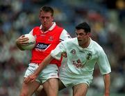 11 June 2000; Martin Stanfield of Louth in action against Dermot Earley of Kildare during the Bank of Ireland Leinster Senior Football Championship Quarter-Final match between Kildare and Louth at Croke Park in Dublin. Photo by Brendan Moran/Sportsfile