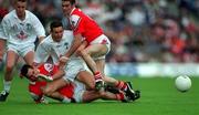 11 June 2000; Padraig Graven of Kildare in action against Brien Philips, left and Brendan Phillips of Louth during the Bank of Ireland Leinster Senior Football Championship Quarter-Final match between Kildare and Louth at Croke Park in Dublin. Photo by Brendan Moran/Sportsfile