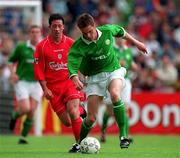 21 May 2000; Steve Finnan of Republic of Ireland in action against Robbie Fowler of Liverpool during the Steve Staunton and Tony Cascarino Testimonial match between Republic of Ireland and Liverpool at Lansdowne Road in Dublin. Photo by Brendan Moran/Sportsfile