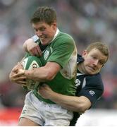 11 March 2006; Ronan O'Gara, Ireland, is tackled by Scott Lawson, Scotland. RBS 6 Nations 2005-2006, Ireland v Scotland, Lansdowne Road, Dublin. Picture credit: Brendan Moran / SPORTSFILE