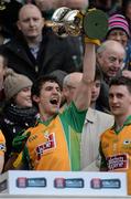 17 March 2015; Daithi Burke, Corofin, lifts the trophy. AIB GAA Football All-Ireland Senior Club Championship Final, Corofin v Slaughtneil, Croke Park, Dublin. Picture credit: Cody Glenn / SPORTSFILE