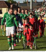 31 May 2016; Richard Keogh of Republic of Ireland and matchday mascots Hassan and Hussein Benhaffaf before the EURO2016 Warm-up International between Republic of Ireland and Belarus in Turners Cross, Cork.  Photo by David Maher/Sportsfile