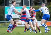 28 March 2015; Max McFarland, Clontarf, is tackled by, Darren Sweetnam, left and Rob Jermyn, Cork Constitution, who is also tackled by Evan Ryan and Rob Keogh, Clontarf. Ulster Bank League, Division 1A, Clontarf v Cork Constitution. Castle Avenue, Clontarf, Co. Dublin. Picture credit: Ray Lohan / SPORTSFILE