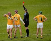 28 March 2015; Ryan McCambridge, left, Antrim, is shown the red card by referee Derek Hughes during the second  half. Allianz Hurling League, Division 1B, Relegation Play-off, Laois v Antrim. O'Moore Park, Portlaoise, Co. Laois. Picture credit: Piaras Ó Mídheach / SPORTSFILE