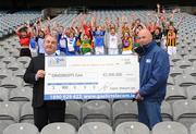 3 April 2008; 32 children, each wearing a different County colour, acknowledge GAA fans and players who to date have pulled their socks up to the tune of 2.9m euro. This is the amount raised by Gaelic Telecom and its customers over three years for Grassroots GAA. Pictured at the announcement are GAA President, Nickey Brennan and Sean Bolger, Chairman of the Imagine Telecommunications Group, owners of Gaelic Telecom. Croke Park, Dublin. Picture credit: Pat Murphy / SPORTSFILE  *** Local Caption ***