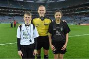 28 March 2015; Match referee Conor Lane with young referees Fionn Halligan, St Pius NS, Tempelogue, and Jasmin Kamtoh, Holy Trinity, NS, before the game. Allianz Football League, Division 1, Round 6, Dublin v Derry. Croke Park, Dublin. Picture credit: Ray McManus / SPORTSFILE