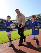 15 April 2008; The GAA and Vhi Healthcare yesterday launched the details of the 2008 Vhi / GAA Cúl Camps programme. The nationally co-ordinated programme aims to encourage primary school children, between the ages of 7 and 13, to learn and develop sporting and life-skills by participating in Gaelic Games. At the launch in Croke Park were Dublin football manager Paul Caffrey with, 6 year old, Eleanor Smyth, from Clontarf, and ,seven year old, Sean Kinsella, from Kilmacud Crokes. Croke Park, Dublin. Photo by Sportsfile