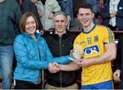 4 April 2015; Siobhan Toale, Director, EirGrid, with Alan Kelly, Eirgrid Community Liasion Officer, presents Diarmuid Murtagh, Roscommon, with the EirGrid man of the match award. EirGrid Connacht U21 Football Championship Final, Galway v Roscommon. Tuam Stadium, Tuam, Co. Galway. Picture credit: Ray Ryan / SPORTSFILE