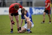 5 April 2015; Down's Darren O'Hagan commiserates with Ross Munnelly, Laois, after the final whistle. Allianz Football League, Division 2, Round 7, Down v Laois. PÃ¡irc Esler, Newry, Co. Down. Picture credit: Mark Marlow / SPORTSFILE