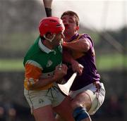 23 March 1997; Hubert Rigney of Offaly in action against Martin Storey of Wexford during the National Hurling League Division 1 match between Offaly and Wexford at St. Brendan's Park in Birr, Offaly. Photo by David Maher/Sportsfile