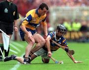 14 September 1997; Tommy Dunne of Tipperary in action against Ollie Baker of Clare during the Guinness All Ireland Hurling Final match between Clare and Tipperary at Croke Park in Dublin. Photo by Ray McManus/Sportsfile