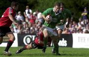 17 June 2000; Kevin Maggs of Ireland is tackled by Scott Stewart and Mark Irvine, 12, of Canada during the Rugby International match between Canada and Ireland at Fletcher's Fields in Markham, Ontario, Canada. Photo by Matt Browne/Sportsfile
