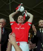 2 July 2000; Cork captain Fergal Ryan lifts the cup after the Guinness Munster Senior Hurling Championship Final between Cork and Tipperary at Semple Stadium in Thurles, Tipperary. Photo by Brendan Moran/Sportsfile