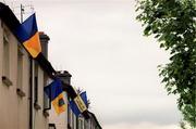 2 July 2000; Tipperary flags hanging out windows in houses prior to the Guinness Munster Senior Hurling Championship Final between Cork and Tipperary at Semple Stadium in Thurles, Tipperary. Photo by Brendan Moran/Sportsfile