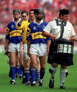 2 July 2000; Tipperary captain Thomas Dunne leads team in the pre-match parade prior to the Guinness Munster Senior Hurling Championship Final between Cork and Tipperary at Semple Stadium in Thurles, Tipperary. Photo by Ray McManus/Sportsfile