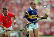 2 July 2000; Brian O'Meara of Tipperary in action against Diarmuid O'Sullivan of Cork during the Guinness Munster Senior Hurling Championship Final between Cork and Tipperary at Semple Stadium in Thurles, Tipperary. Photo by Brendan Moran/Sportsfile