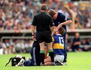 2 July 2000; Eugene O'Neill of Tipperary is attended to by medical personnel during the Guinness Munster Senior Hurling Championship Final between Cork and Tipperary at Semple Stadium in Thurles, Tipperary. Photo by Brendan Moran/Sportsfile