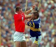 2 July 2000; Diarmuid O'Sullivan of Cork in action against Paul Shelly of Tipperary during the Guinness Munster Senior Hurling Championship Final between Cork and Tipperary at Semple Stadium in Thurles, Tipperary. Photo by Ray McManus/Sportsfile