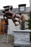 23 April 2008; Workmen remove an advertising statue from outside the room where a press conference was held ahead of their Heineken Cup semi-final game with Saracens on Saturday next. Munster rugby squad press conference, Kilmurray Hall, University of Limerick, Limerick. Picture credit: Ray McManus / SPORTSFILE