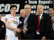 8 April 2015; Robin McCormick, EirGrid, centre, presents the Man of the match to Ruairi Brennan, Tyrone, along with Martin McAviney, Ulster GAA President, right. EirGrid Ulster U21 Football Championship Final, Donegal v Tyrone, Celtic Park, Derry. Picture credit: Oliver McVeigh / SPORTSFILE