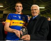 9 April 2015; John O'Connor, Chairman, EirGrid, presents Tipperary's Ian Fahey with the EirGrid man of the match award following the EirGrid Munster U21 Football Championship Final between Tipperary and Cork at Semple Stadium, Thurles, Co. Tipperary. Picture credit: Stephen McCarthy / SPORTSFILE