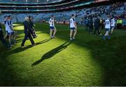 12 April 2015; Monaghan players and officials walk off the pitch at the end of the game after defeat to Dublin. Allianz Football League Division 1, Semi-Final, Dublin v Monaghan, Croke Park, Dublin. Picture credit: David Maher / SPORTSFILE