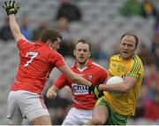 12 April 2015; Colm McFadden, Donegal, in action against Tomás Clancy, 7, Cork, supported by team-mate Brian O'Driscoll. Allianz Football League Division 1, Semi-Final, Cork v Donegal. Croke Park, Dublin. Picture credit: Piaras Ó Mídheach / SPORTSFILE