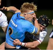 16 April 2015; James Tracy, UCD, goes over for a try despite the challenge of Ruadhan Magee, Trinity. Annual Rugby Colours, UCD v Trinity. UCD Bowl, Belfield, Dublin. Picture credit: Pat Murphy / SPORTSFILE